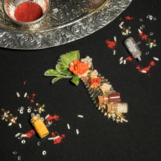 Roli Chawal Gut Nariyal on  a metal leaf
