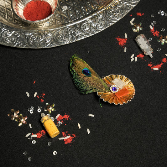 Roli Chawal on gota with peacock feather