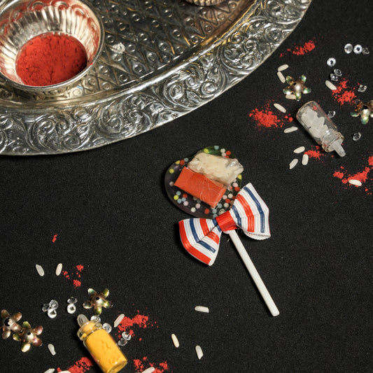 Roli Chawal on Lollipop Stick